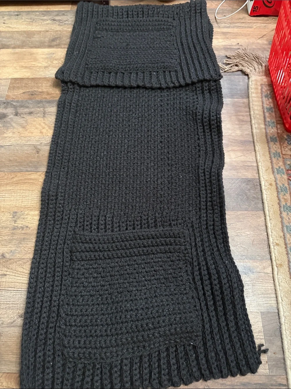Artisan Black Ribbed Knit Throw Blanketwith pockets for storing things on couch