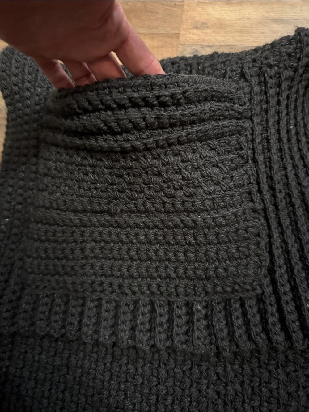 Artisan Black Ribbed Knit Throw Blanketwith pockets for storing things on couch